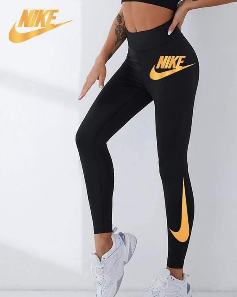 Leggin Nike en dorado para mujer - Imagen 1